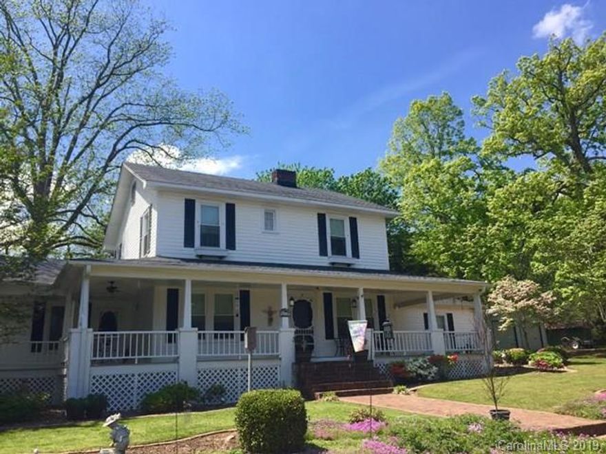 Turn of the century farmhouse! This updated 4 bedroom, 3 bath home on a 1.5 acre lot is just amazing. Once you walk through the door you will appreciate all of the work that has went into this home to keep it looking great. First floor features a beautifully updated kitchen with a breakfast area. Also it has what could be a formal dining room or just an extra family room. Large living room with a very nice fireplace. First floor also includes an in-law quarters with plenty of room for friends & family that are coming into town but the in-law quarters is 450 sq ft but not connected to a permanent heat source.. Upstairs offers 3 bedrooms and a kids play area with a full bath. ***1 year home buyer warranty***
