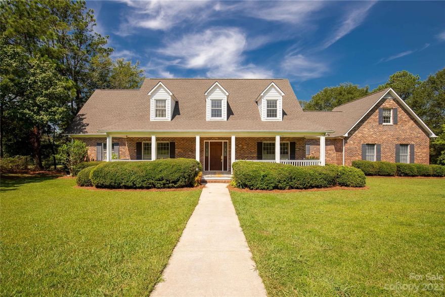 North Corner Estates! This home is the one you have been waiting for! 
Custom built with great attention to detail, this property has everything that you need. Located on 2.63 acres with four bedrooms and 3.5 baths, beautiful sun room, custom kitchen, with brick floors and accents. Natural Wood and brick give this home an traditional look with custom built ins, wainscoting, and wood floors. Second stairway leads to finished room above the garage that could be an office or other multiple uses. Open floor plan, deck, pool, and sun room are great for entertaining. This subdivision includes fishing rights for a large pond that is steps away. Home has 3,384 square feet of heated an cooled space with two systems, one for each level.
Privacy within one of the most desirable locations in Lancaster, North Corner Estates is conveniently located a half mile from the intersection of Highway 521 and Highway 5. Pineville, Charlotte Rock Hill, Interstate 77 are just minutes away.