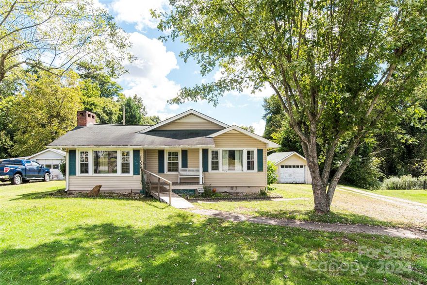 Check out this gem! This 3-bedroom, 1-bath home offers classic charm with hardwood floors, a large living area with a cozy gas log fireplace, and beautiful knotty pine paneling. The kitchen comes equipped with a refrigerator, dishwasher, and electric range. Step outside to find a 1-car detached garage and a spacious 22x41 workshop with 10-foot ceilings, wired for both 220 and 110—perfect for working on cars, woodworking, extra garage space, or storage. Conveniently located close to shopping and town, yet far enough away to enjoy peace and quiet. Call today to make this home yours!