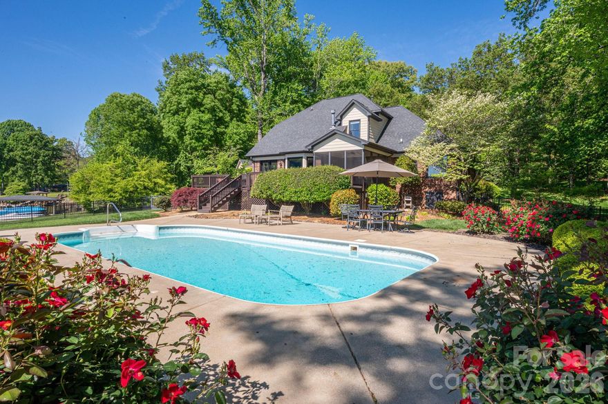 ONE OF A KIND RARE opportunity awaits you with this Custom Built Home on an incredibly GORGEOUS WATERFRONT lot. Over an acre!  Saltwater Swimming Pool. Boat dock with power lift. No HOA. Live in Paradise every day with this property. Brick home featuring 3 bed/2.5 baths. Step in to beautiful hardwood floors at the entry foyer and living room. Fresh interior paint throughout. Primary on the main level with tray ceiling and ensuite. Walk-in closet. Living room with double sided fireplace, Kitchen/Dining area with breathtaking views. Granite countertops, newer gas cooktop stove, stainless steel refrigerator.  Mud room with laundry. 2-car garage and tons of parking in the large driveway. Upstairs you will find two additional bedrooms and full bath. Another huge plus to this home is there is a good amount of storage/unfinished square footage that could be converted into additional HLA. Entertaining Haven with the screened porch, large deck and fenced back yard with pool. Beautifully manicured lot that has irrigation in place. The rose bushes add a touch of beauty to an already amazing lot. Lawn has irrigation. Newer water heater. Encapsulated crawlspace with transferable termite bond. Don't miss this chance to get your spot on the lake! Book your showing today.