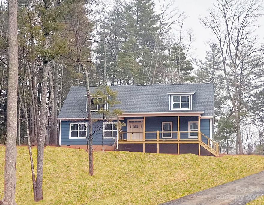 Welcome to Cascade Ridge, one of Western NC's newest communities! This new construction is built in a modern farmhouse aesthetic and offers an expansive front porch, spacious rear deck, hardboard siding, and mountain views. The interior boasts an open floorplan, kitchen island, laundry room, and a beautiful owner's suite with a walk-in closet & freestanding tub. There is also room to grow and let your DIY imagination come alive with an unfinished upper level with 884 sqft. of space and stairs in place to connect. Located in Fairview, just a short drive from downtown Asheville, independent coffee shops, local breweries, and eclectic restaurants will be some of your new and closest neighbors! The neighborhood allows short-term rentals. Call to schedule your appointment!