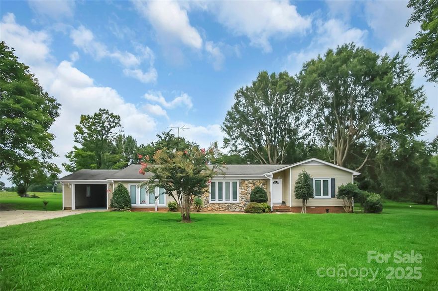 Renovated single-story home offering 3 bedrooms and 2 bathrooms on a quiet dead-end street, perfect for peaceful rural living. Inside find carefree LVP flooring throughout. The floorplan includes a dining room, mudroom with laundry & kitchen, which features white cabinets, butcher block countertops, stainless steel range & a modern multifunction sink. The home continues with two spacious living areas, each with a fireplace, creating cozy gathering spaces. Two bedrooms feature ensuite baths, while the third has a large walk-in closet and French doors opening to a covered back deck. The expansive backyard is ideal for entertaining or enjoying outdoor leisure.