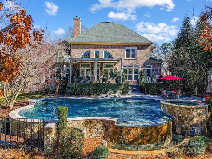 Nestled within the prestigious River Run Country Club this residence offers a harmonious blend of luxury and comfort. The gourmet kitchen is a chef's dream, featuring double islands, elegant marble countertops with full inset cabinetry, and professional grade appliances. The main level features porcelain wood plank tiles and is illuminated by exquisite Currey & Company light fixtures, complemented by automatic window coverings for added convenience. Stepping outside, the property unveils a heated infinity-edge pool complete with a hot tub, tanning ledge and travertine decking overlooking the 7th tee box of RR golf course. Residents of River Run enjoy access to top-tier amenities, including a private golf course, tennis courts, a modern pool and fitness complex, and dining. The community is further enhanced by parks and walking trails, promoting an active and engaging lifestyle. Membership is required for access to amenities. See additional upgrades in MLS Attachments.