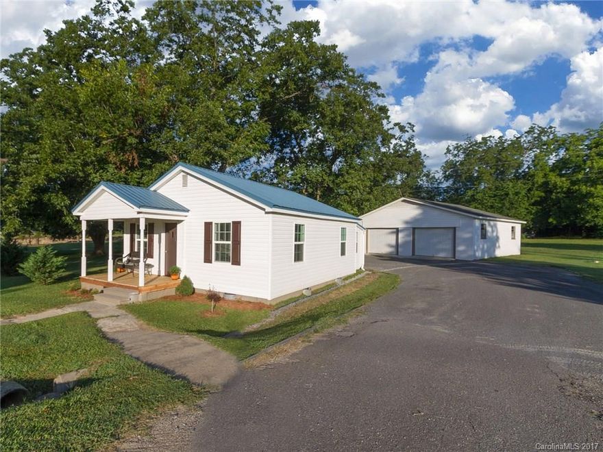 This cute and cozy 2 bed/1 bath home is absolutely adorable.  Home completed remodeled in 2013. New flooring, new plumbing, new electrical, new siding, new roof, updated kitchen, bath, laundry room, hot water heater and the list goes on and on. Enjoy your evening outside on the covered front porch or on the back patio where the breeze never stops. Spacious 30x30 two car detached wired garage/shop. Just minutes from I-77, shopping and dining. This one won't last long! Bring your buyers today!!!