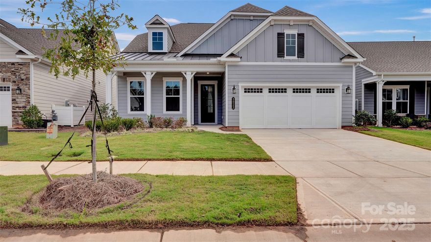 **NEW CONSTRUCTION** This 2 Bedroom, 2 Bath home with a versatile Flex Room and a spacious 2-Car garage is located just a short stroll from the community’s Amenity Center, picturesque nature trails, and a future Community Garden. Inside, the Owner’s Bathroom offers a luxurious daily experience with a rain head shower, standard head, and an oversized bench. The gourmet kitchen is a showpiece, fitted with quartz countertops, upgraded cabinetry, GE Profile appliances, a gas cooktop, and a farmhouse cast iron sink that adds a charming touch. Complete with under-cabinet lighting and a built-in refrigerator facade for sleek symmetry. The extended garage offers extra space for hobbies or storage, and the covered lanai has a 5-foot privacy wall inviting quiet moments outdoors. The backyard opens to a peaceful common area with no direct rear neighbors and newly planted trees that frame a natural, elevated landscape behind the home, enhancing privacy.