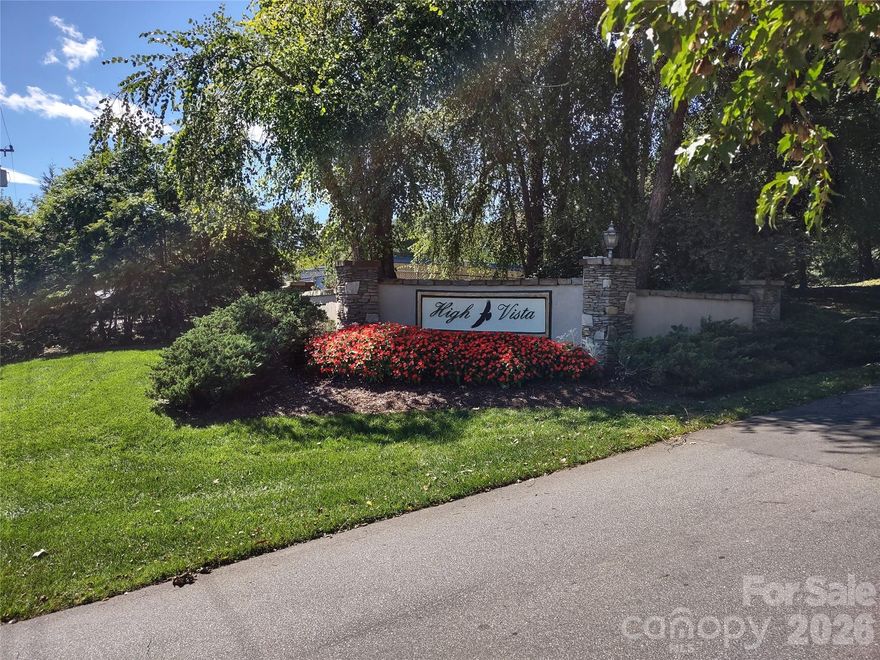 Enjoy nature and the beauty of western mountain views when you build your home on this sloping lot located in High Vista Estates.   This gated community features a golf course and clubhouse with restaurant, tennis courts with memberships available.  Community has a community park with picnic area and playground.   Conveniently located with a short drive to the airport and close to schools and shopping .