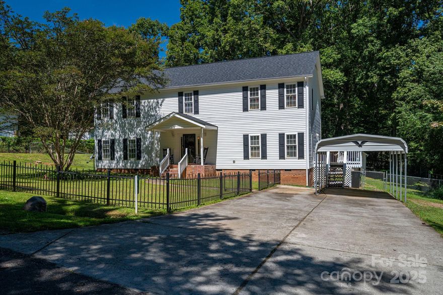 You don't want to miss this spacious 4BR/2.5BA 2 story home on 0.53 acres in Cherryville with approx 2940 sq ft priced at $101 sq ft! This two-story home features a welcoming layout with living room, dining room, family room, and large eat-in kitchen with island. Primary suite offers dual vanities, garden tub, separate shower, and HUGE walk-in closet. Major updates include new water heater (2021), new roof (2023), and new lower-level HVAC (2023). Home also has a whole-house water filtration system. Exterior highlights: fenced front & back yards, carport, and a storage building and a play house. Home is tucked towards the end of a dead end street surrounded by trees for the ultimate feeling of privacy!
