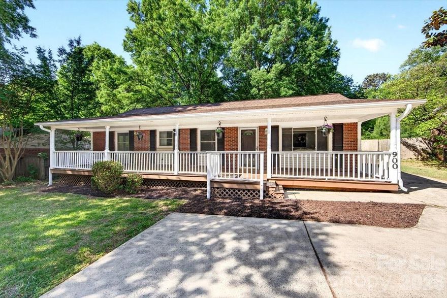 Move-in-ready ranch ideally located just a short walk from the dining, shopping, and entertainment in the heart of downtown Matthews, with quick access to I-485 for an easy commute. Enjoy a prime location near the Mecklenburg County Sportsplex at Matthews and a short walk to the entrance of the Four Mile Creek Greenway. This charming one-story home is highlighted by a large front porch, perfect for relaxing and enjoying outdoor living space. Inside, you'll find fresh neutral paint and a bright kitchen featuring newly installed granite countertops and backsplash. Durable tile flooring throughout offers easy maintenance and a pet-friendly living environment. Outside, the large driveway with an extended concrete pad provides ample parking for multiple vehicles. The spacious fenced backyard offers room to play, garden, or entertain, while the detached garage includes a separate room ideal for a home office, workshop, or additional storage. The additional 212 sqft includes 44 sqft of heated/cooled utility room space that is part of the home but not accessible from the main living area. The remaining 168 sqft is office space located in the detached garage.