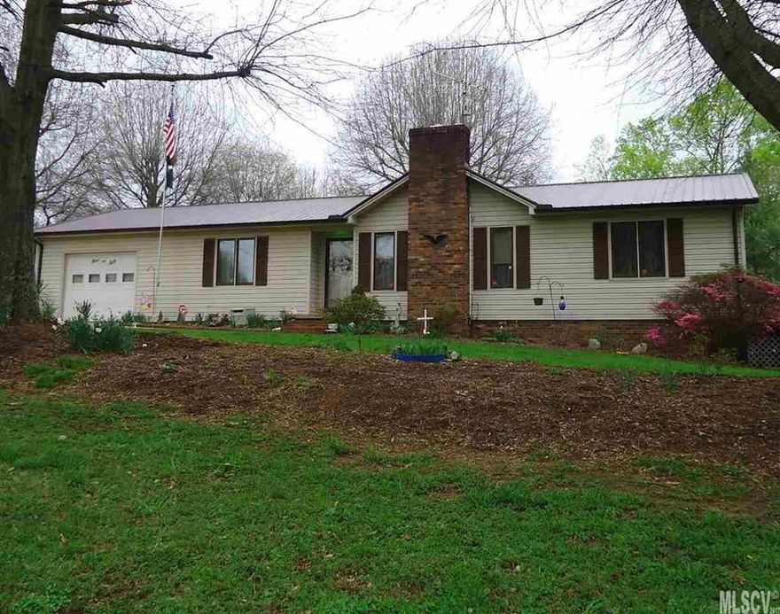 This is a very comfortable home built on a spacious country lot, a very short distance to Bethlehem, Taylorsville and Hickory.  A large master bedroom, with bath and walk-in closet, and two other bedrooms and a guest bath.  There is a comfortable living room, with a gas log fireplace and a vaulted ceiling.  The dining room is between the living room and the kitchen and you may also step from the dining room to a nice rear deck.  In the back yard there is an excellent 16’x30’ workshop.  You don’t have to look very hard to see evidence of home gardening in the backyard. And there is a double carport in the rear that the owners have used for storage.  The basement has had lots of work done in it and it is roomy and comfortable.   Another carport is on the end of the house, and it has a gravel driveway.  This property is very homey and it presents many different opportunities here.