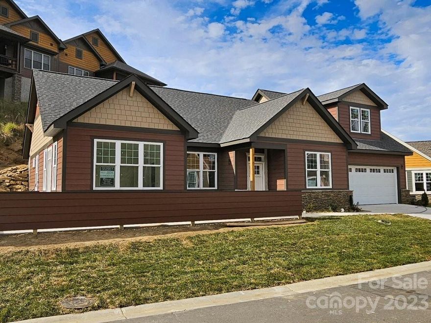 MOVE-IN READY: The Brentwood 2; A single-family home with an open floor plan with a perfect kitchen for entertaining. Bright & spacious one-level living. Split bedroom main level with two masters with bathrooms and walk-in closets. Arts & Crafts style with partially covered front porch, sun room, custom features, granite, hardwood floors, gas fireplace. Enjoy meeting your new friends in the completed Clubhouse with heated pool, fitness center, walking trails & nature park with fire pit. Full city amenities with underground utilities, city sewer & water, yet county-only real estate taxes. Convenient to downtown Asheville, only 12 minutes! Pinebrook Farms - Where the Living is Easy!

NOTE:  The rear wall of the home is built into a slope and functions as a retaining wall, causing the main level of the home to be reported as a basement (per MLS rules) even though it is at street level.  No actual below-grade basement exists below street level.