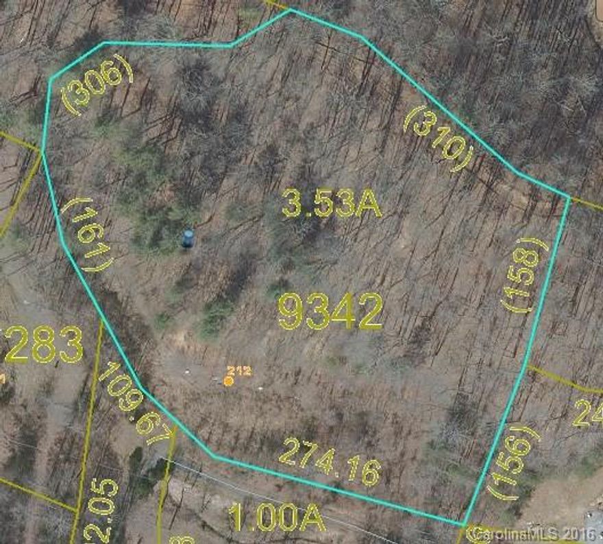 3.53 ACRES. ALL UTILITIES ON SITE, READY FOR YOUR NEW HOME. Well, septic, electric, plus ribbon footing for double wide or modular. Conveniently located between Bakersville and Spruce Pine off Mine Creek Road.  Can be subdivided.