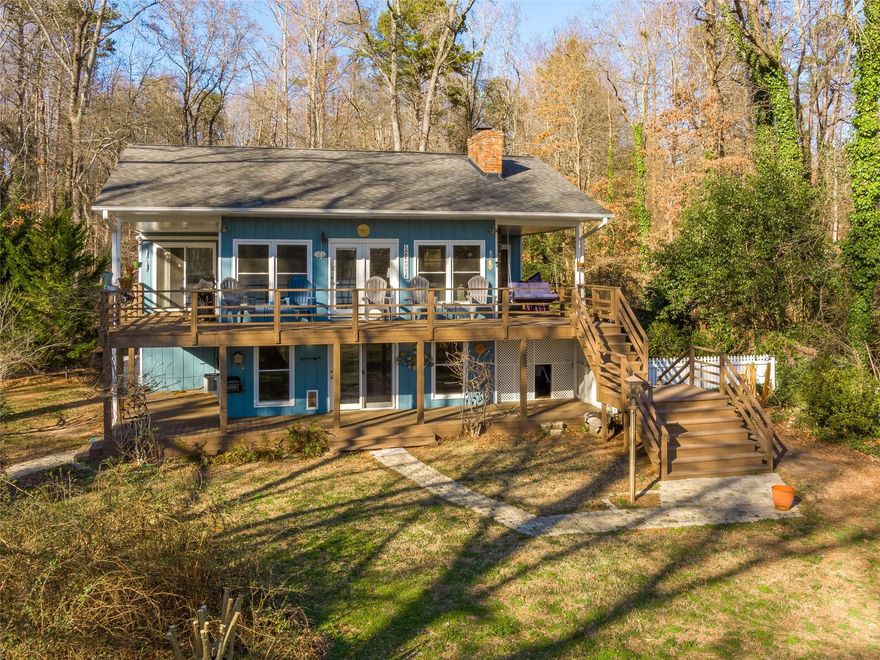 RARE OPPORTUNITY to enjoy LAKE FRONT life on the highly sought-after Lake Bowen! This exceptionally desirable and hard to find0.85 acre lot is FLAT, open, and waiting for you! It features 105' of OPEN water frontage, a fenced in yard, and an outdoor shower. You'll appreciate the ease of the walk to the edge of the water where your private beach and dock await you. The 3 bedroom, 2 bath home has a beautiful open floor plan and a dreamy lake view. Both main floor bedrooms step out to the wrap around porch where you can watch the sunset and relax and unwind in peace and tranquility. The main floor bedrooms feature a Jack-and-Jill style bathroom, each with its own en suite vanity and commode. Unwind by the gas log fireplace. Open kitchen offers beautiful views & plenty of natural light. Whether this is your primary residence or weekend getaway, you'll be sure to love making lake memories!