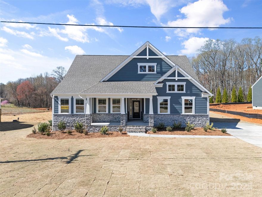 PROPOSED/TO BE BUILT by Eastwood Homes. Located in the vibrant area of Statesville, experience unparalleled beauty in this semi-custom built home, perfectly blending elegance with Craftsman charm.

Located in the vibrant area of Statesville, experience unparalleled beauty in this semi-custom built home, perfectly blending elegance with Craftsman charm. Perched on nearly 2 acre lot of ultimate privacy.

The Sullivan is a three-bedroom, two-bath, ranch-style home with a side-load garage, crawl space foundation, dedicated home office, a spacious family room, kitchen with island and pantry, and a separate breakfast area, a covered rear porch, and a first-floor primary suite.

Options to personalize this home include a finished storage area, a first-floor powder room, a formal dining room, several primary bath options, and an optional second floor with a loft, bedroom, and an additional bath.

GPS 173 Laurel Cove Rd; Agent has ownership interest in land.