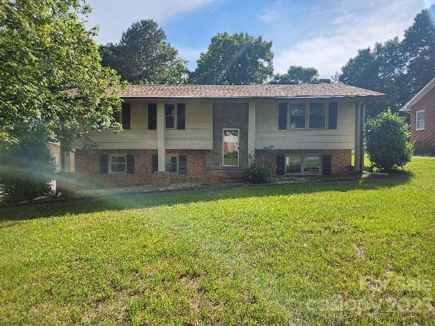 4 bedroom 3 bath split fover home in the city of Hickory NC. Main level features a large living room/dining combo with an updated kitchen. Master suite with private full bath plus 2 addt bedroms and a 2nd centrally located full bathroom. Full basement is partially finished providing bedroom #4, bathroom #3/laundry room, and a HUGE bonus room. Exterior boasts a spacious back yard with an outbuilding that has a finished interior. Property is owned by US Dept of HUD and is sold AS-IS/WHERE-IS with all faults.Buyer or 
buyers agent to verify all stats.HUD Case#387-132246.Purchase this home using FHA Financing with ALMOST NO 
MONEY DOWN!See your agent for details.Property is eligible for FHA Uninsured(UI) financing pending updated 
appraisal.Property is FHA 203K rehab eligible. Seller will contribute up to 3% of purchase price for buyers closing costs if requested with offer. EQUAL HOUSING OPPORTUNITY