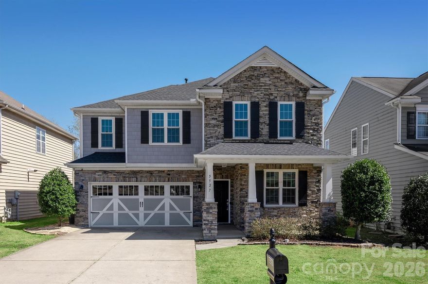 Freshly painted and brand new carpet -this one is truly move-in ready! Beautifully updated home located in a highly sought-after neighborhood with outstanding community amenities. The updated kitchen features quartz countertops, a large island, and opens to the two-story great room with a gas fireplace—perfect for everyday living and entertaining. A covered porch addition overlooks a premiere private and fenced backyard, offering peaceful outdoor living. Gorgeous primary bathroom has been fully renovated. Home office or flex room on the main level and LVP flooring throughout main. Complete with a two-car garage, this home combines updated style, comfort, and location. New windows 2022. New roof June 2023 w/ 2 years left on warranty. HVAC & furnace replaced 2020.