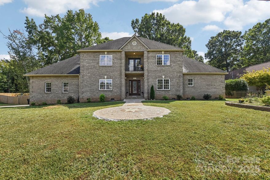 This beautifully designed two-story home offers four bedrooms and four bathrooms, combining modern comfort with thoughtful functionality. The heart of the home is a sleek, contemporary kitchen featuring quartz countertops, stainless steel appliances, stylish backsplash tile, and modern hardware throughout. The main-level primary suite provides a true retreat, complete with a luxurious en-suite bathroom and an expansive walk-in closet. The laundry room and powder room are conveniently located between the kitchen and the entry from the attached two-car side-load garage—making daily routines seamless and efficient. Upstairs, you'll find well-appointed secondary bathrooms with tile, vanities, and tub/shower combinations. A spacious open loft overlooks the second-story living room, perfect for lounging or study space. A large bonus/playroom with large skylight offers versatile options for a quiet home office, media room, or entertainment space. Additional highlights include: Neutral paint tones and low-maintenance luxury vinyl plank (LVP) flooring throughout the main level, modern light fixtures and contemporary hardware, two staircases for added convenience and private access between living areas, custom accent wall in the dining room/foyer area, and an expansive yard fully enclosed with wood fencing—ideal for outdoor activities and entertaining. This home seamlessly blends space, style, and smart design—perfect for entertaining, or simply enjoying everyday comfort.