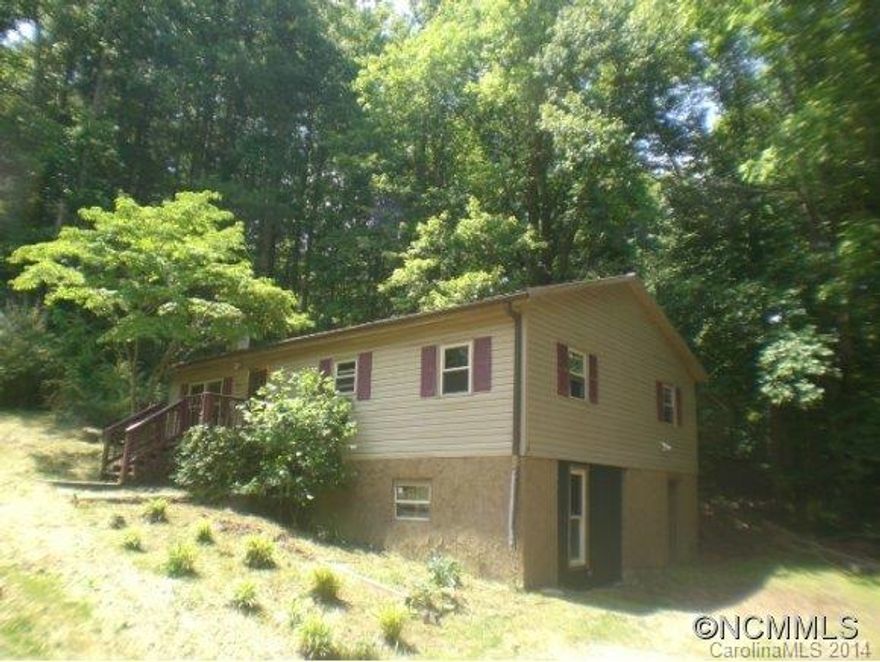 Enjoy country living with only a short drive to town! On 1.12 acres this home boasts a large kitchen, generous cabinet space, family-sized bath with jet tub, metal roof, unfinished basement, dual pane windows, laundry on both levels, deck, front porch, & raised garden bed. Move-in ready! Purchase with the adjoining 0.8 acre lot for an additional $10,000! Possible lease purchase.