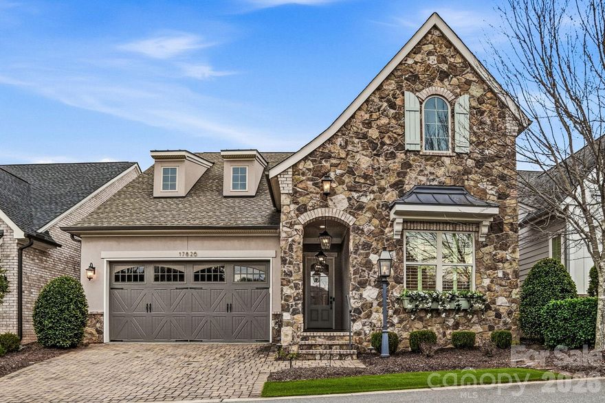 Experience refined living in the heart of Cornelius, including the rare opportunity for assignment of a Full Golf Membership to The Peninsula Club. This former Classica model home showcases exceptional craftsmanship, designer lighting, custom millwork, and abundant natural light throughout.

Designed for an effortless lock and leave lifestyle, the open floor plan blends comfort and sophistication. Retractable corner sliders create seamless indoor-outdoor living, opening to a heated screened porch and private outdoor retreat ideal for year-round enjoyment.

The chef’s kitchen anchors the home with an oversized island, abundant cabinetry, and a thoughtfully designed laundry/drop zone with built-in desk. A custom wine room with display windows and accent lighting adds warmth and character for entertaining.

The primary suite offers dual vanities, an oversized walk-in shower, and a custom closet with direct access to the laundry room for everyday convenience. A second primary suite on the main level enhances flexibility for guests or multigenerational living.

Upstairs, a spacious loft with projector and theater screen, dedicated office, and private guest suite with en-suite bath provide additional living space. 

Located in a boutique community with Jetton Cove pool access and just moments from shopping, dining, Jetton Park, walking trails, and I-77, this home offers an exceptional lifestyle opportunity in one of Cornelius’ most desirable locations, with the opportunity to skip the waiting list at The Peninsula Golf Club!