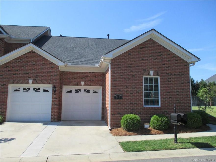 Like New !!! Former Model Home master on the main and 2nd bedroom, 3rd bed, loft and bath upstairs.   This Beautiful immaculate all brick townhome has an open floor plan with hardwoods, granite and stainless.  Bricked in patio area for privacy.  It is located in a gated community with a beautiful pond.  The seller has added additional insulation and more walk in storage.  The 2 car garage is attached with storage as well.  Close to 77, great location to shopping and dining.  This is a must see !