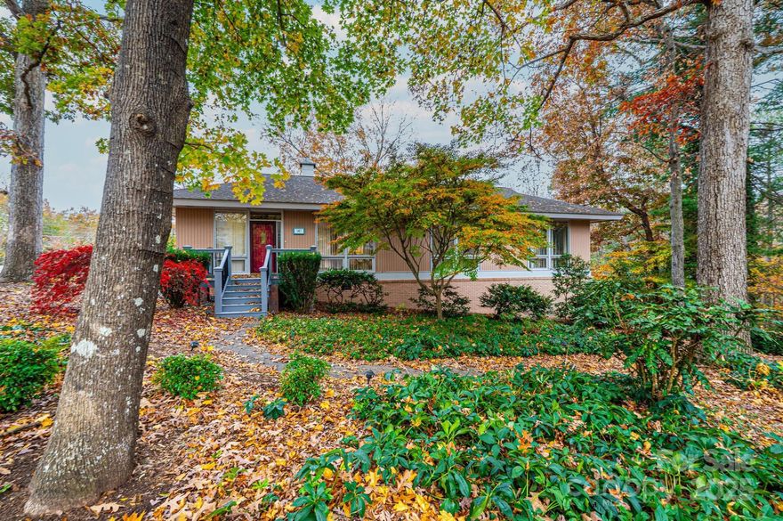 Discover a rare gem in the heart of Hickory—a distinctive 1960s Mid-Century Modern residence that beautifully blends architectural pedigree with enduring charm. Designed and owned originally by renowned local architect Philippe Gilissen and a Crouch Built Home, this property stands as a testament to timeless design and thoughtful craftsmanship. Nestled on a lush, professionally landscaped lot enhanced by the artistry of ScenicView, the home is framed by mature trees and natural beauty, offering a serene setting that complements its architectural integrity. Inside, the main level welcomes you with a warm and inviting ambiance, where cork flooring flows seamlessly throughout, adding both comfort and character. The main floor layout is as functional as it is stylish, featuring two spacious bedrooms, two full baths with classic tile finishes, an office, a generous family room anchored by a cozy fireplace, a formal dining area, and a well-appointed kitchen designed for everyday living. A striking spiral staircase serves as a sculptural centerpiece, leading to the lower level where versatility abounds. Here, you'll find a third bedroom and a flexible bonus room—ideal for an exercise space/office/den or creative retreat—with direct access to the outdoors. There is also a heated/cooled room perfect for a craft/art room with storage shelves. (Not included in heated sqft due to ceiling height being less than 7' represented by the 244' of other sqft.  Mechanical room has some extra space for small workshop table and storage. Lovingly maintained by the 2nd owner for over 45 years, this home radiates pride of ownership and offers a rare opportunity to own a piece of Hickory’s architectural heritage. Whether you're a design enthusiast, a lover of mid-century aesthetics, or simply seeking a home with soul and story, this property invites you to experience a lifestyle rooted in quality, character, and quiet sophistication. House is currently on a septic system. Seller has paid for sewer tap if the buyer prefers to connect it to City sewer. GIS lot measurements are not correct. Seller bought a "sliver of property" to the right of the bottom driveway a few months after purchasing the house and property. Dimensions noted in the listing are more accurate but still apx. Lot is apxs .69 of an acre. Carport has a nice storage room connected to it for outside yard tools, etc.