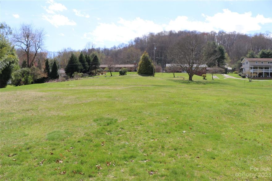 Rare find level topography in town lot located minutes from Main St. Waynesville. Features 1.79 acres with small creek. Access is from Auburn Park Drive. Plenty of room for family estate, recreation, and gardening.