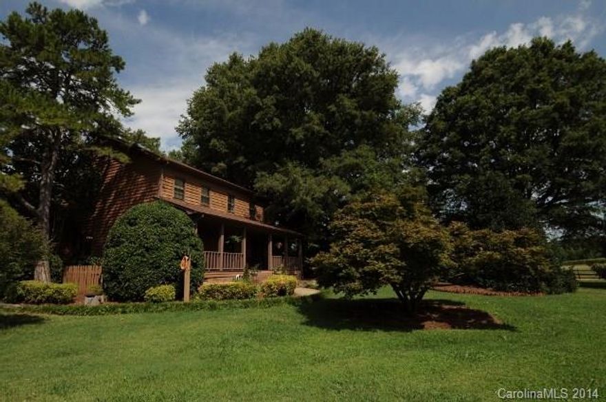 One of a kind home in Fort Mill that sits on 1.25 acres! It offers a mother-in-law quarters that houses 2BR, 1.5 baths, living area with fireplace and full kitchen. This could also be used as a pool/party house! Main home offers large great room with fireplace, huge dining room and kitchen with work island.  Master on main with beautiful updated master bath. Sunken sun room offers great views of pool and back yard. Lots of time will be spent in the patio/pool area.Two gas tiki porches and grill.