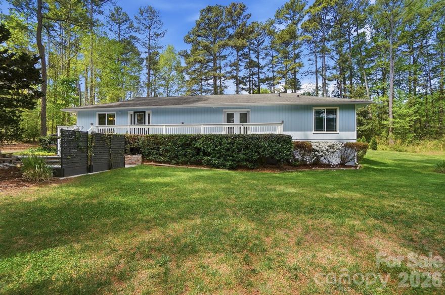 Experience the best of both worlds with this inviting single-story ranch, offering a peaceful, country-style setting while remaining conveniently located within the city. Situated on a generous 0.61-acre lot, the property provides space, flexibility, and a sense of privacy that is increasingly hard to find.  Inside, the home has been freshly painted throughout, creating a clean and refreshed interior ready for its next owner. The living room features a gas fireplace, adding warmth and character to the main living space. The seller installed 1/2inch plywood and then sheetrock on the walls of the living room to help sound stay in the living room and not carry into the bedroom areas.  Major updates include a water heater installed in 2025 and windows replaced within the past five years, enhancing both efficiency and comfort.  The furnace was replaced in 2022.  Outdoor living is a true highlight of this property. A newly installed front water feature in 2025 enhances curb appeal, while the backyard offers a private retreat complete with an above-ground pool surrounded by a deck, ideal for relaxing or entertaining. The expansive lot provides ample room for outdoor enjoyment, gardening, or future possibilities, with the added benefit of a private well for irrigation, helping to manage utility costs.  There are grapevines behind the pool and blackberry bushes in multiple locations in the backyard.  For those needing additional workspace or storage, the property includes a 22’ x 24’ detached garage or workshop that is insulated and fully powered with its own junction box, ideal for hobbies, projects, or equipment. A second 10’ x 12’ powered storage building is located behind the home, providing even more versatility.  This property presents a rare opportunity to enjoy space, functionality, and a serene setting while maintaining close proximity to everyday conveniences.  Sellers have a home warranty in place for your buyers that will transfer to the new owners for a full year of coverage paid for by the sellers.