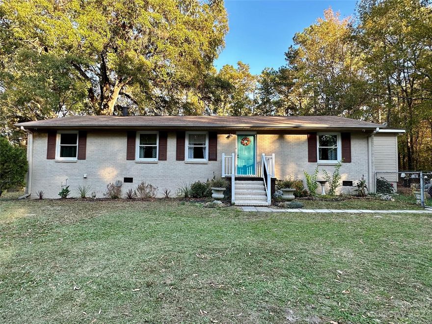 Located minutes from I77, this is the perfect location for commuters to Charlotte or Columbia.An all brick ranch home located on a quiet country street features a great floorplan with 3 bedrooms with hardwood floors, 2 full baths with tile, large living room with dining area, and adorable kitchen with plenty of counterspace. Off the kitchen is a sunken family room that houses a wood stove, and cozy environment for game nights. The flex room with walk in closet is currently used as a 4th bedroom. This area could be a wonderful in-law suite. A safe is secured to the concrete floor will remain with the home, as well as wood stove and all appliances. There's a great patio in the back  fenced yard. The swingset and shipping container will remain if interested. The home has been attractively decorated but more importantly are the updates. It has all new plumbing with water filtration system, a new septic system with all new drain lines, new wiring and updated electrical panel. A great find!