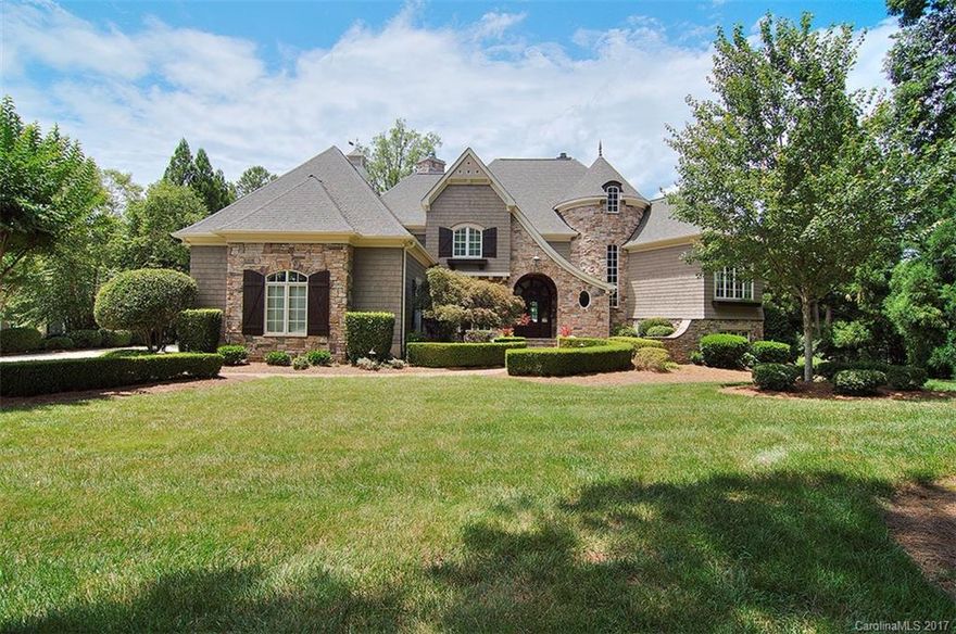 Lake living at it's finest with open views so far you can see Little Mountain in the distance, deep water year round for your boat and an upgraded 10,000lb boatlift. This magnificent home has a beautifully designed kitchen with it's own fireplace, spa like master bath with heated tile floors. Upstairs has a great bonus/playroom area and  the PERFECT  space to create an amazing theater room.  There is laundry hookup on every floor, including the master closet. Wine cellar & guest suite downstairs