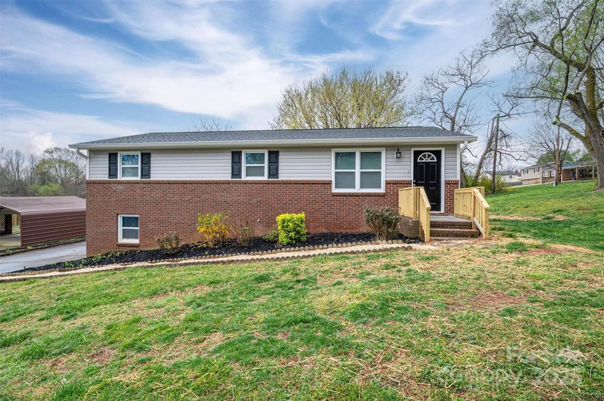Discover this delightful 3-bedroom brick and vinyl ranch, ideally located just south of Claremont. With quick access to I-40, this home offers convenience to local amenities and the Hickory Metro and Statesville areas.  Step inside to find a spacious den that flows seamlessly into the kitchen, featuring classic white cabinetry, sleek black appliances, and a dining area—perfect for gatherings. Each of the three bedrooms are generously sized and boasts brand-new carpet flooring.  The full, unfinished basement provides endless possibilities for additional living space, a garage, or extra storage. This home is a fantastic opportunity for affordable homeownership. Don’t wait—schedule your showing today before it’s gone!