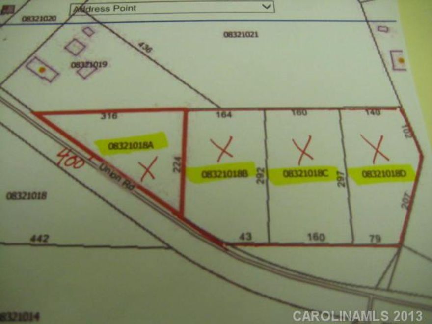 3.7 acres consists of 4 parcels, 400' (approx) frontage, wooded. Look for real estate signs to locate frontage at site. Site is limited for septic placement.  Call Union County Health Dept to walk site if interested.