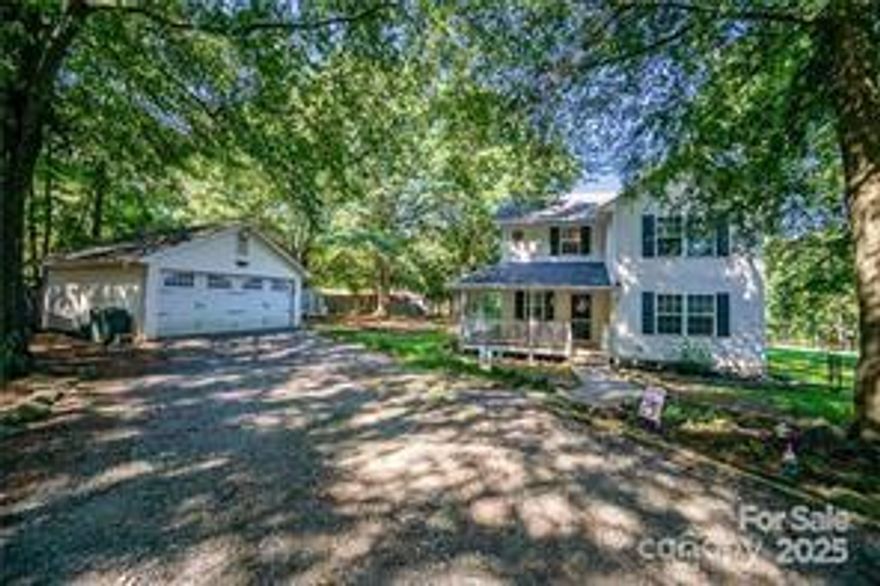 Here is the one you have been waiting for!  Your own little piece of paradise....  NO HOA and over 3 acres of gorgeous property.  This much-loved home features a private country setting in desirable Clover!  Enjoy your morning coffee while relaxing on the quintessential wrap-around porch.  This mini estate boasts such a tranquility with its gorgeous, tree-lined entrance and sprawling back yard.  Got chickens?  With NO HOA - you can surely have them here!!  Located in sought after Clover this home also features two very large, stocked ponds for you and the family to enjoy. Some interior features include a true wood burning fireplace in the living room, quartz countertops and stainless-steel appliances in the kitchen, and a walk-in shower in the primary bath.  Imagine waking up to peaceful water views, gathering fresh eggs, and sipping coffee on your porch surrounded by nature - all just minutes from town.  This precious home is ready for its new owners - bring your offers today!!