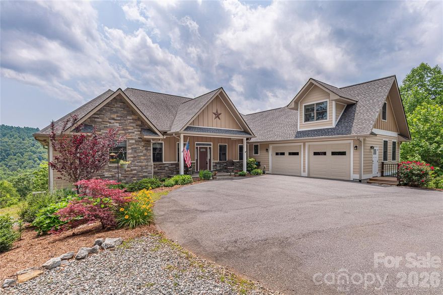 Discover this majestic Saluda retreat, set on nearly 7 acres of pristine land & over 3 acres cleared. Meticulously maintained and thoughtfully upgraded boasting a whole-house generator for peace of mind in any weather, an RV-ready set up with electrical hookups next to the heated detached garage. Garage has it's own propane tank and a mini fridge stocked and ready for hanging out in any season. Soak in BIG mountain views from the expansive back deck made with durable Trex board and a screened-in porch designed for entertaining. Enjoy surround sound speakers around the gas fire as you kick your feet up and enjoy the game or the epic sunsets! With the classic luxury of large rooms, 2 fire places, vaulted ceilings & an updated kitchen with polished granite counter tops, you'll never want to leave. 10 miles to Hendersonville, 20 miles to AVL & Asheville Regional Airport for endless entertainment, fine dining, and outdoor adventures. HOA says Short Term Rentals and goats are allowed. Furniture is negotiable. Do not miss it!