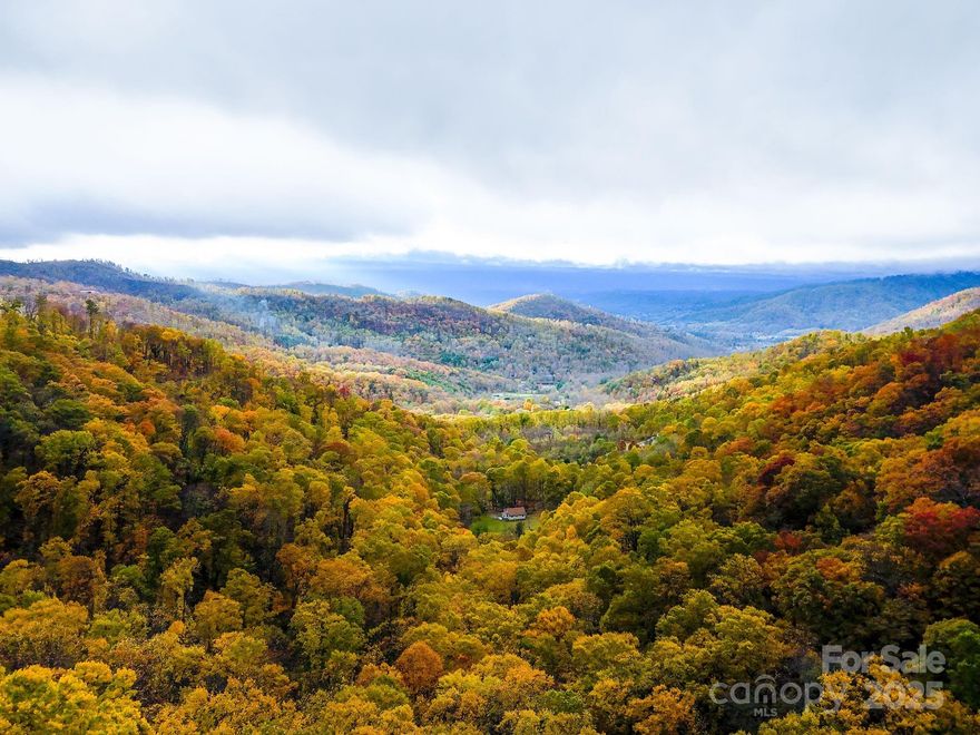 Escape to 46 acres of breathtaking mountain beauty in the heart of Ox Creek Valley, Buncombe County—just minutes from Asheville and the Blue Ridge Parkway. This heavily wooded property rises high into the Asheville Mountains, offering sweeping panoramic views and unmatched privacy. With private dirt road access and direct adjacency to the historic Rattlesnake Lodge Trail System, it’s a dream setting for hiking, horseback riding, or simply reconnecting with nature. Zoned for flexible use, this land offers endless potential—from a boutique mountain resort, residential development, or the ultimate private estate perched at the top of your very own mountain. A rare opportunity to own a true piece of the Blue Ridge.