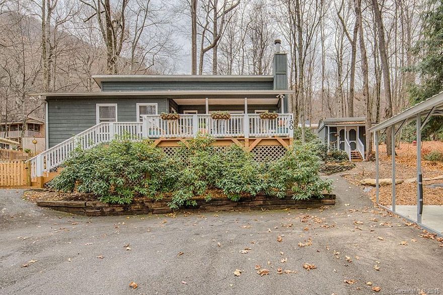 Adorable cottage with tons of updates. Excellent condition with open floor plan, large kitchen and two large bedrooms. Also: Hardwood floors, vaulted ceiling, central heat and air, beautiful stone gas fireplace with large hearth, great front deck, charming screened back porch, carport and fenced area for your dogs. Easy paved access, circular driveway, great location and low utility bills. New septic installed in March 2016. A rare find in this price range!