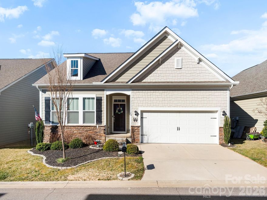 Welcome to 16 Southern Way Lane, where natural light fills the open living space, highlighting warm wood floors, a gas fireplace, and expansive windows that frame year-round Blue Ridge Mountain views. The layout is effortless and inviting, designed for both everyday living and memorable gatherings. At the center, the kitchen makes a statement with a substantial granite island, stainless steel appliances, and seamless flow into the dining and great room, creating a space that feels connected, functional, and refined.

The split-bedroom design offers privacy and balance, with a spacious primary suite that feels like a true retreat, complete with a walk-in closet and a well-appointed bath. The full daylight basement presents exceptional flexibility for future expansion, whether you envision a guest suite, media room, or dedicated home office. Outside, the covered rear porch captures long-range mountain views that define life at Rose Hill Plantation. Located within a gated community offering a clubhouse, fitness center, pool, garden area, and walking trails, this move-in-ready home delivers quality construction, sought-after amenities, and the lifestyle that makes Western North Carolina one of the most desirable places to call home.