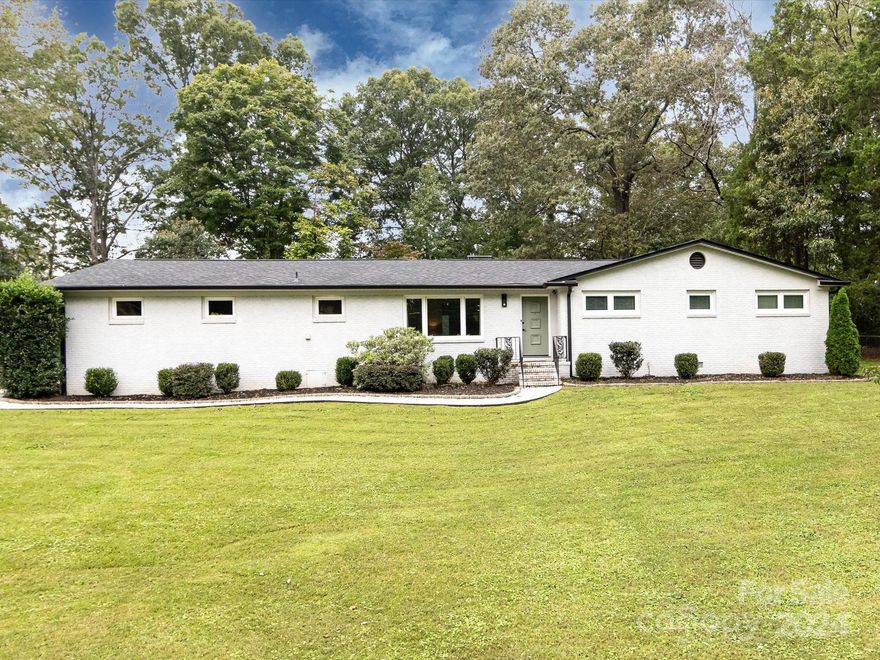 Beautifully updated full brick ranch just minutes from Uptown! Nestled on nearly half an acre on a corner lot, this charming home boasts 3 spacious bedrooms, 2 full baths, and a versatile office space. The open-concept layout offers a seamless flow from the kitchen to the dining and living areas, perfect for entertaining. The updated kitchen shines with granite countertops, stainless steel appliances, under cabinet lighting, and a sleek tile backsplash. Both bathrooms have been tastefully modernized, and LVP flooring extends throughout the entire home. Major updates include HVAC (2018), roof (2019), all windows (2019), and water heater (2020). Rear load 2 car garage with additional storage room and a spacious walk-in pantry/laundry room. Situated on a quiet dead-end street, enjoy the tranquility by your fire-pit, while being close to city conveniences! And no HOA!