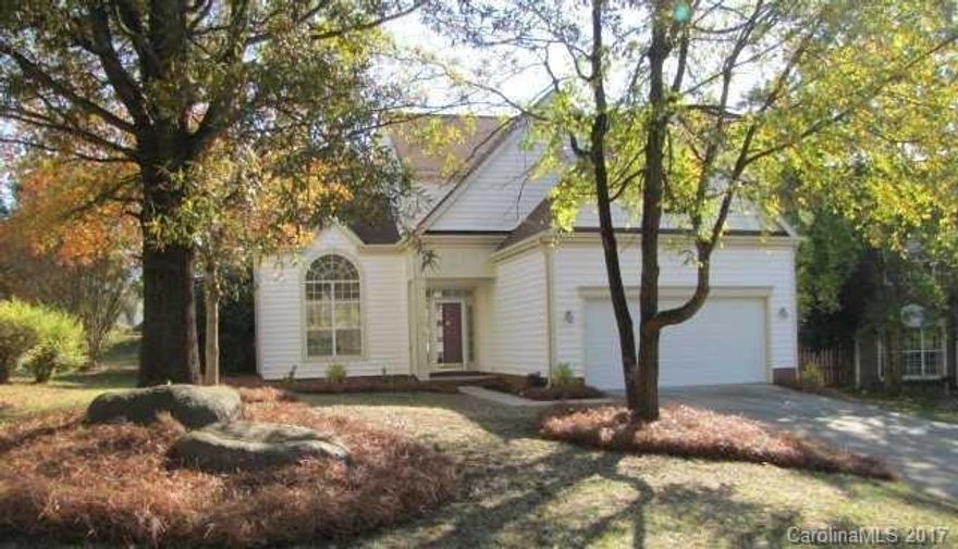 This fantastic home in a quiet cul-de-sac in Steele Creek offers lots of character, including crown molding, wainscoting, and formal rooms ideal for family gatherings. The family room has a fireplace with beautiful paneling above. Double doors lead into the master suite, which features a walk-in closet, and a bath with a dual sink vanity. A spacious covered patio overlooks the fenced back yard. Community pool and tennis courts.