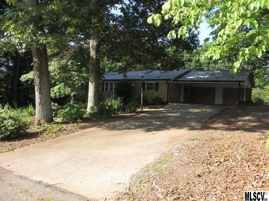 Nice Brick Ranch w/ full basement! Hardwood floors &crown moldings, spacious bedrooms, vinyl replacement windows, formal living & cozy den w/fireplace & ceramic tile surround, Workshop in basement, lower den w/masonry fireplace, laundry area w/extra sink, walkout basement.  Large screened porch, above ground pool w/plenty of decking for grilling/entertaining. Located minutes from I-77!