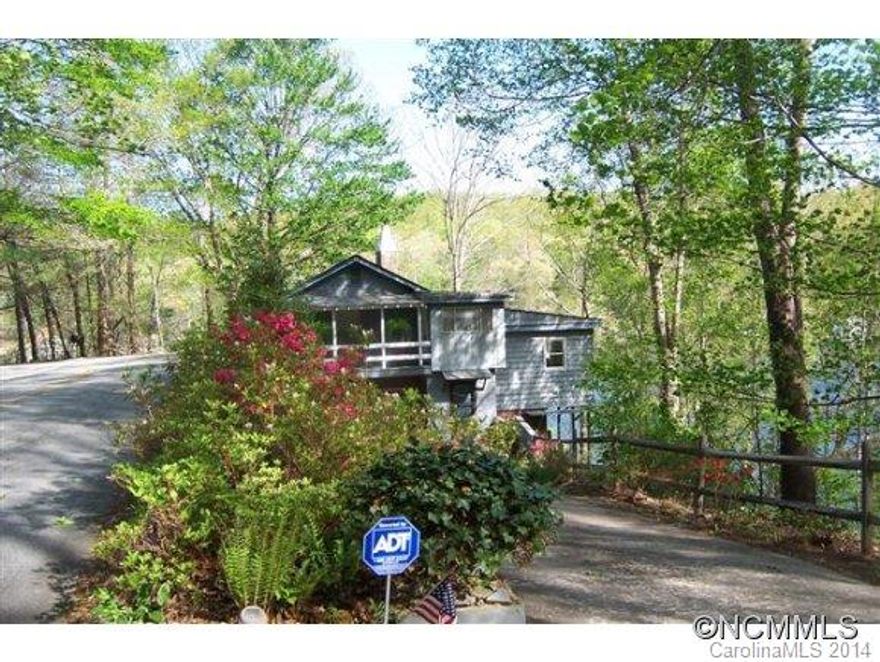 Lake front home on basin 2 with spectacular views from majority of the rooms - dock & boat house - all on 1.03 acres with parking for at least 8 cars.The home has a living room /dining room combo w/ wrap around views and wood burning fire place. Galley kitchen w/ breakfast bar. 2 covered decks provide room for relaxation and there is a 6x25 cover porch off 3rd BR.Second kitchen and bonus area provide that extra room for entertaining