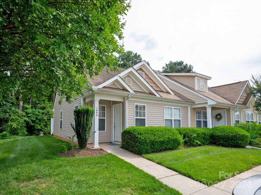 Adorable END UNIT townhome with easy access to I-77/I-85, and just minutes from shopping and dining in Ballantyne, NC or Indian Land, SC. This beautiful townhome features an open concept floor plan perfect for living and entertaining.  Neutral and bright kitchen with newly painted white cabinets, new hardware, and new lighting throughout most of the home.  Separate dining area and large island create an enjoyable cooking and dining experience.  Luxury vinyl wood flooring throughout the first floor.  Two secondary bedrooms, full bath, and laundry room on the main level.  Spacious owner's suite with private full bath, oversized closet, and TWO large storage areas complete the second floor. Private backyard facing the woods. Relax on the patio, grill outdoors, or enjoy the large green space and play! Community amenities include a pool, picnic area, sidewalks, and streetlights!  Low South Carolina taxes and award-winning Indian Land Schools!  Welcome to this charming home!