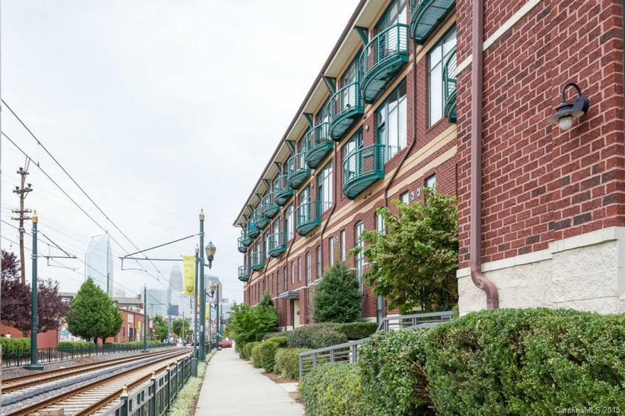 Modern style 1-1/2 story loft condo in the heart of historic South End. Awesome view of Uptown from this balcony! Hardwood floors on main level, Floor to ceiling windows in Great room. Kitchen has 42" cabinets, granite countertops and new stainless steel applcs! Fridge and washer/dryer included! Secure building and parking deck. Amazing views of Uptown & South End from 5th floor rooftop terrace! Walk to restaurants, shopping, nightlife, stadium or hop on the trolley or light rail to Center City!