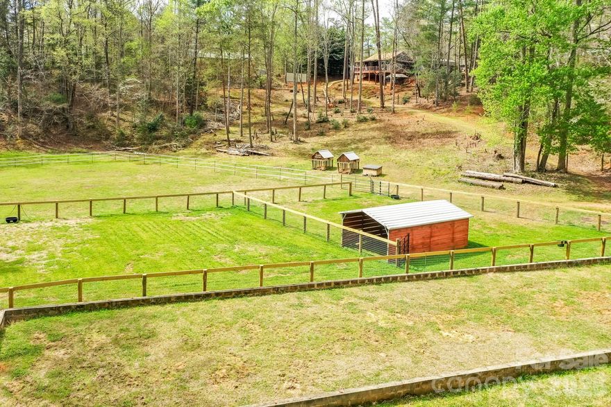 GENTLEMAN'S FARM NEAR LAKE LURE! Located just 10 minutes from Lake Lure, this 5.86 acre mini-farm has a nice creek flowing through the pastured bottom land and includes a horse barn and multiple other outbuildings along with an ideal site for a spring-fed pond. The property also includes a newly constructed 2 bedroom home (built 2022) overlooking the pasture! If you're looking for an affordable mini-farm with privacy and no restrictions.......this may be the right property for you. This property is located 1 mile off pavement on a gravel road. Only $410,000.