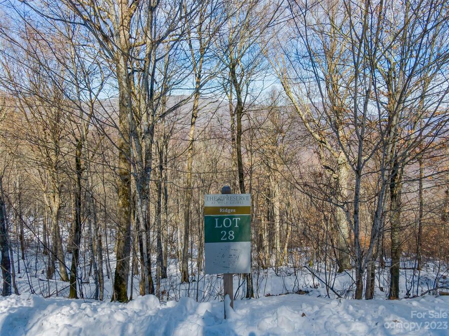 Come breathe in the mountain air at The Preserve at Wolf Laurel! A new home community that offers optional access to adjoining Wolf Laurel Country Club, hiking and ATV trails, and more! The development is surrounded by 700 acres of Conservation Land yet is a 30 minute drive to Asheville and only a 15 minute drive to Town of Burnsville. This lot is perfect for those who are looking for views and higher elevations. Come for a tour and enjoy some time on the mountain!