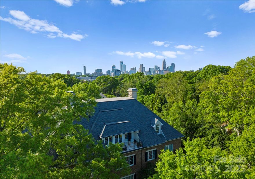 Set along one of Charlotte’s most distinguished residential corridors, this exceptional whole-floor penthouse at 974 Queens Road presents a rare convergence of scale, privacy, and architectural refinement. With a recent $250,000 price reduction, the opportunity to acquire a residence of this stature has become even more compelling.

Spanning more than 5,300 square feet, the residence occupies an entire floor and is framed by expansive east- and west-facing terraces—an uncommon luxury in such a prestigious, established setting. Morning light filters through the treetops, while evening skies unfold across the skyline, creating a serene yet dynamic backdrop throughout the day.

A secure elevator delivers you directly into a gracious foyer, setting the tone for the home’s thoughtful layout and elegant flow. Ten-foot ceilings, wide-plank hardwood flooring, and walls of glass define the interiors, while three gas fireplaces introduce warmth and architectural presence to the primary living spaces.

The kitchen is both refined and functional, appointed with premium appliances, custom cabinetry, distinctive tilework, and a waterfall-edge quartz island. Open to a light-filled family room with built-in cabinetry, the space is designed to support both everyday living and sophisticated entertaining.

The primary suite offers a true sense of retreat, with direct terrace access, a spa-inspired bath, and a generously scaled custom closet. Additional bedrooms and flexible living spaces provide comfort and versatility for guests, offices, or extended stays—each finished with the same attention to detail and proportion.

Outdoor living is a defining element of this penthouse. The expansive terraces extend the living experience beyond the interior, offering rare, usable outdoor space well-suited for entertaining, quiet reflection, or simply enjoying the mature canopy that surrounds the property.

With its recent price improvement, this penthouse stands as a distinguished offering for those seeking privacy, volume, and timeless appeal in one of Charlotte’s most desirable neighborhoods. A residence of quiet confidence—now thoughtfully repositioned.

Shown by private appointment.