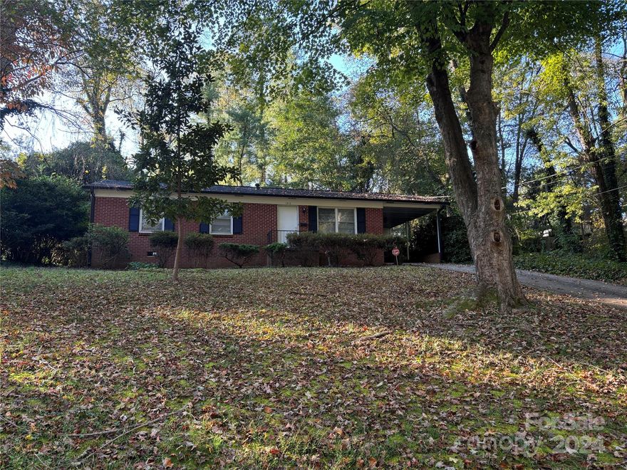 Charming Fixer-Upper with so much potential. Conveniently located near the I-77/I-40 interchange, this 3-bedroom, 1 and half bathroom home is tucked away in a well-established neighborhood that offers easy access to highways and amenities. Built in 1970, it still has some original charm, featuring hardwood floors that are ready to be refinished. The property has carport for parking or covered storage. This home is in need of TLC but has great bones and endless potential for the right buyer or investor. Home is being sold AS-IS with no repairs to be made by the seller.