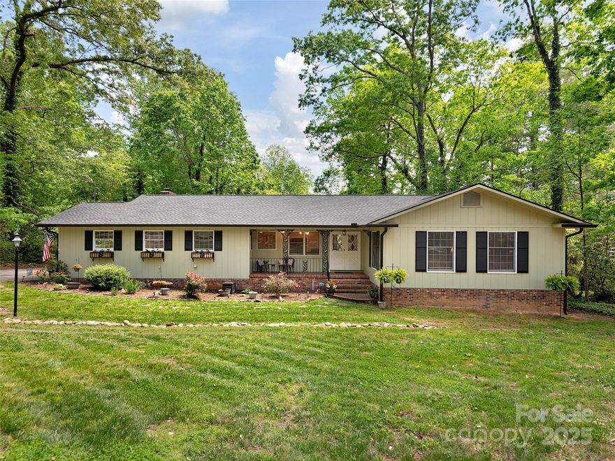 Beautifully updated home in sought-after Hawthorn Hills, just minutes from downtown Hendersonville. Enjoy over 3,000 sq ft of living space with a brand-new roof (2022), fresh exterior paint (2025), quartz countertops (2025), and Samsung appliances (2022). The kitchen features a center island and breakfast nook, while the living and sitting rooms offer wooded views and a peaceful creek. Original hardwoods, new carpet, updated lighting, and fresh paint throughout. In addition to the main bedrooms, the home offers three flexible bonus rooms (not counted in septic permit), plus a spacious lower-level bath with new tile—perfect for guests, an office, or creative space. Enjoy a nature-infused open living room with a bay window overlooking the creek in the back, perfect for entertaining!