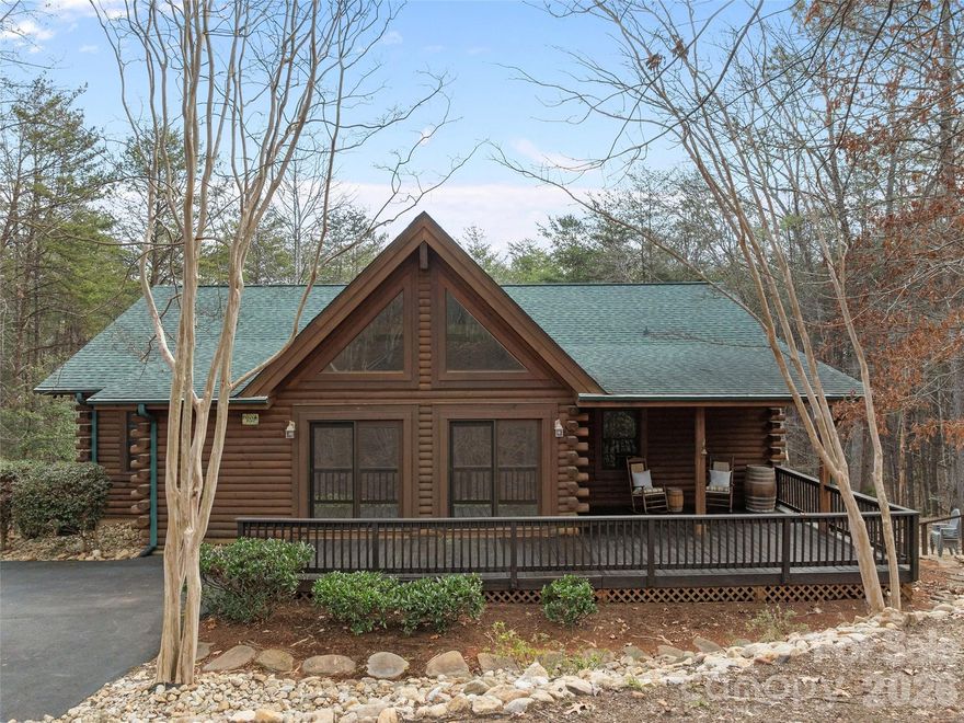Nestled  in the sought-after Shumont Estates of Lake Lure, this crafted log home offers 3, 724 +/- square feet of heated living space and is being sold furnished for a truly turnkey opportunity. Designed for comfort and convenience, all bedrooms are located on the main level, including a spacious primary suite featuring gas log fireplace, walk-in closet, linen closet, and private bath. The inviting living rom is accented with gas logs and rich wood details, creating a warm mountain lodge ambiance. The kitchen features vaulted wood ceilings and flows into the dining area, perfect for gathering and entertaining. The lower level provides additional living space with a family and entertainment room, recreation room, full bathroom, laundry room and multiple storage closets. Ideal for guests, game nights, or extended stays. Surrounded by the natural beauty of Rumbling Bald and the area of Lake Lure, this furnished log home is well-suited as a full-time residence, vacation retreat, or investment property. (Some furniture items are staged items which are not included in the sale of the home)