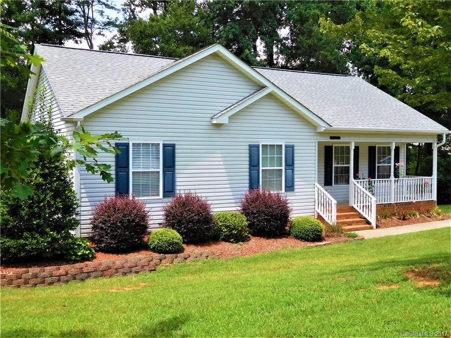 JUST REDUCED! Don't miss this lovely 3 bedrm/2 bath ranch w/vaulted ceiling in great room & tray ceiling in master. Open kitchen & dining area w/additional seating at the bar.  Large laundry room w/window & pantry off the kitchen. Nice front porch. Relax on the deck above or the cozy patio below.  Large lot (.36 acre) w/wooded areas in the back & to one side. Tall crawl space great for storage! Walking trails & a quick walk to the Greenway.  Neighborhood located minutes from downtown Fort Mill.