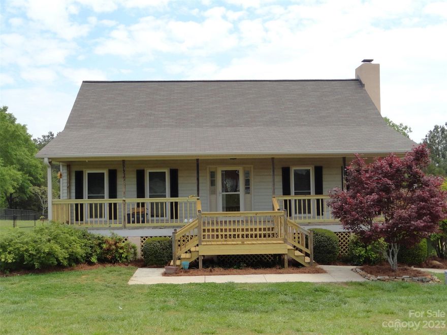 Lovely 1.5 Story Country Home on 2.5 Acres with Inviting Large Covered Front Porch. All New Windows. Spacious Great Room features Stone Fireplace, 2 ceiling fans, Double Glass Doors to Screened Porch. Granite Kitchen with Dining Room w/Bay Window and Door to Screened Porch. Primary Bedroom Suite on Main. 2 Bedrooms & 2 Full Baths on 2nd level. (One with Shower, One with Tub/Shower). Laundry Room on main. Fenced Rear Yard. 1 Car Garage in Rear used for Equipment storage. New 2 ton AC Units. Fresh Paint. No HOA. Located on Cul-de-sac Street.